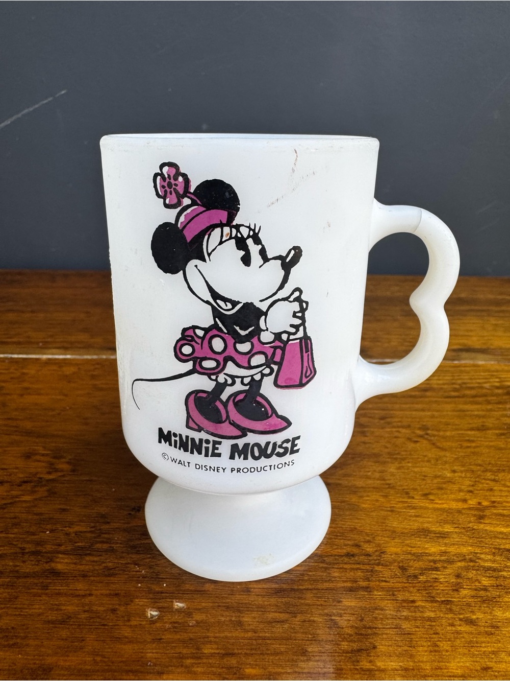 a vintage Disney Productions Minnie Mouse milk glass pedestal mug